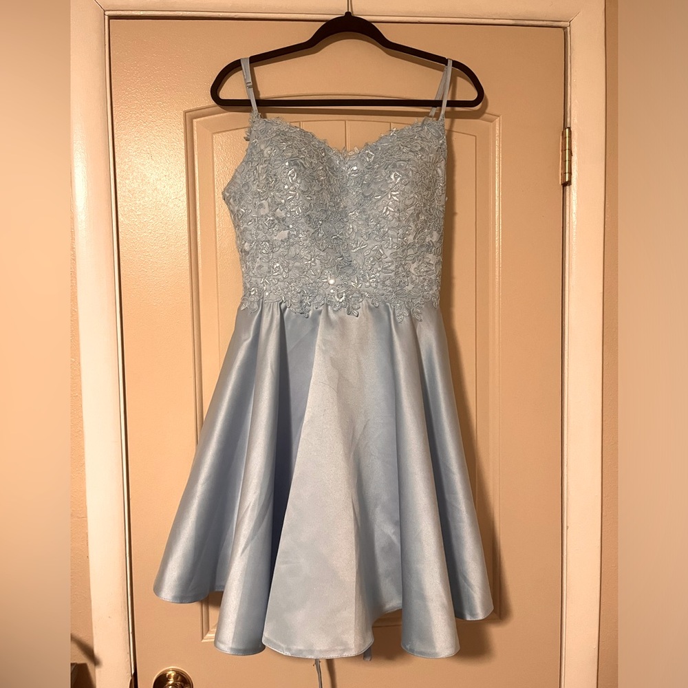 Worn Once, Has Built In Padding,The back has a lace up back with zipper as well